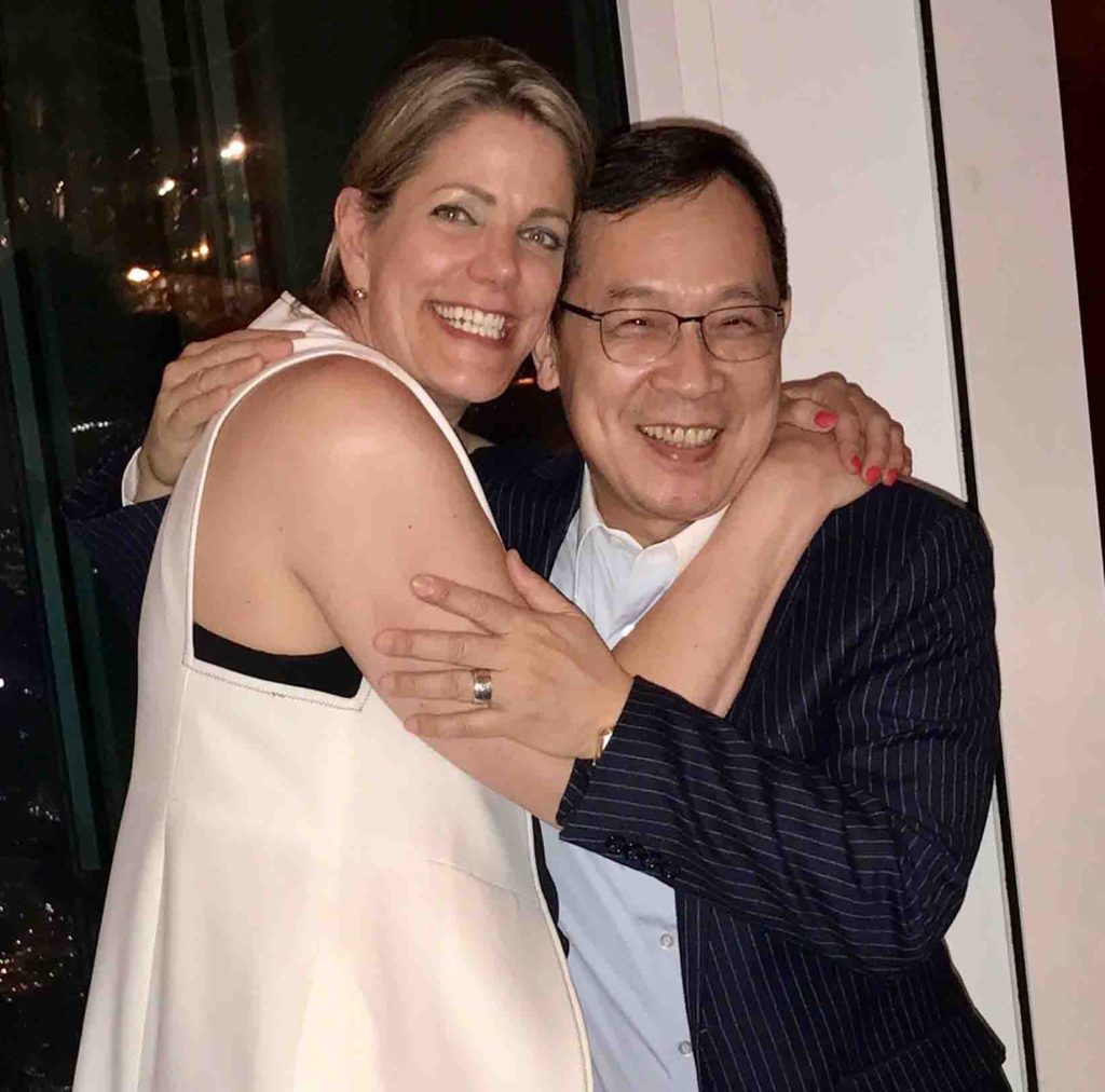 Kirsten K. Harris with Kevin Chen, President of Eclat Garment Manufacturing, during a working meeting.